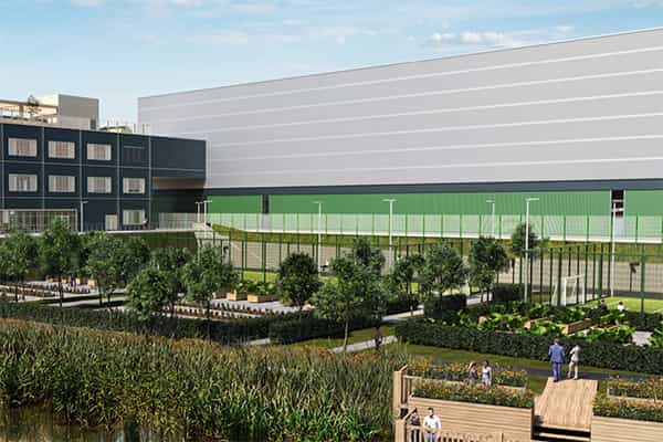 a warehouse facility with a garden and a green roof