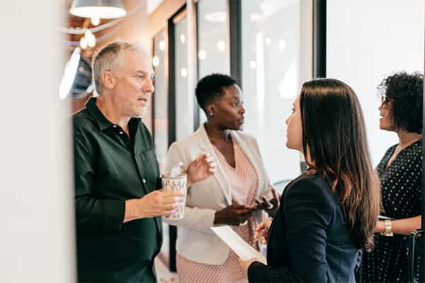 colleagues discuss driving ideas, inclusivity and creativity through DEI