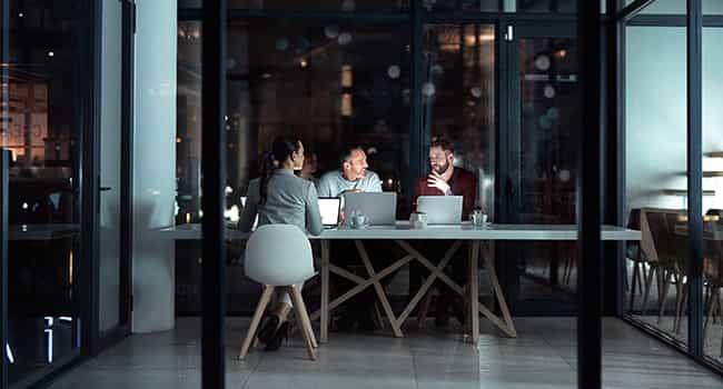 business owners consult with a real estate advisor in a meeting room in a modern office setting
