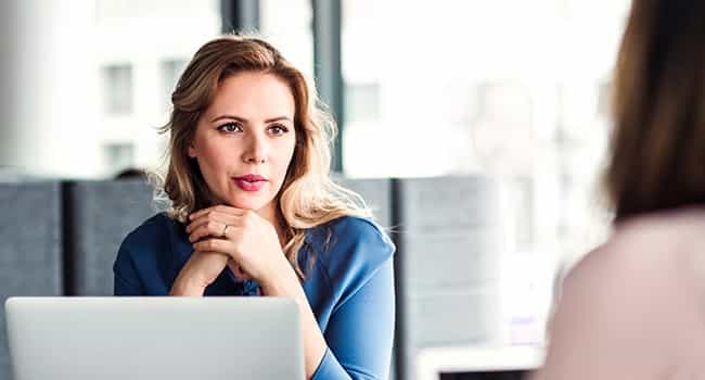 life sciences professional discusses property lease and sale options with a real estate advisor