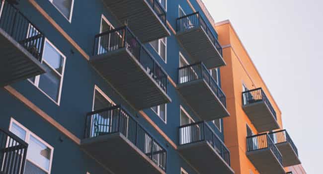 upward looking view of a multifamily property available for purchase by a real estate investor