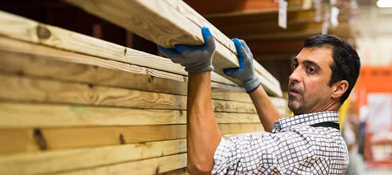 a worker moves construction materials for a commercial real estate development