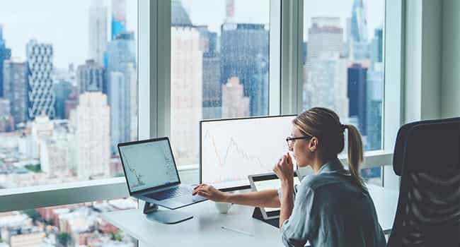 a real estate professional evaluates market trends in a high rise office