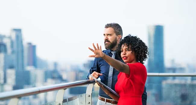 a real estate advisor talks with a property owner about their real estate needs