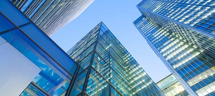 An image looking up at glass skyscrapers in Central London