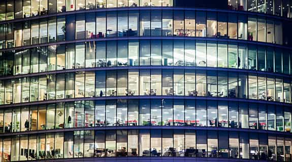 A view of office windows in Central London at night