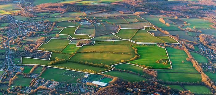 Aerial view of land in Kent primed for 2000 new homes