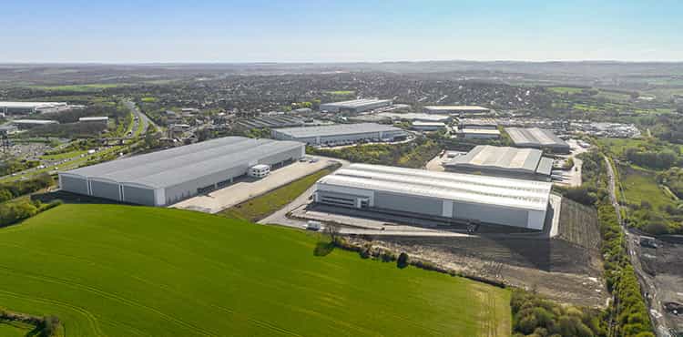An aerial image of a group of large industrial warehouse buildings