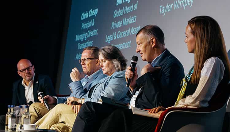 Members of the Avison Young at a panel discussion at UKREiiF