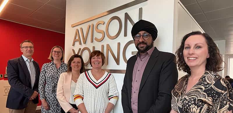 An image of the staff returning to Avison Young