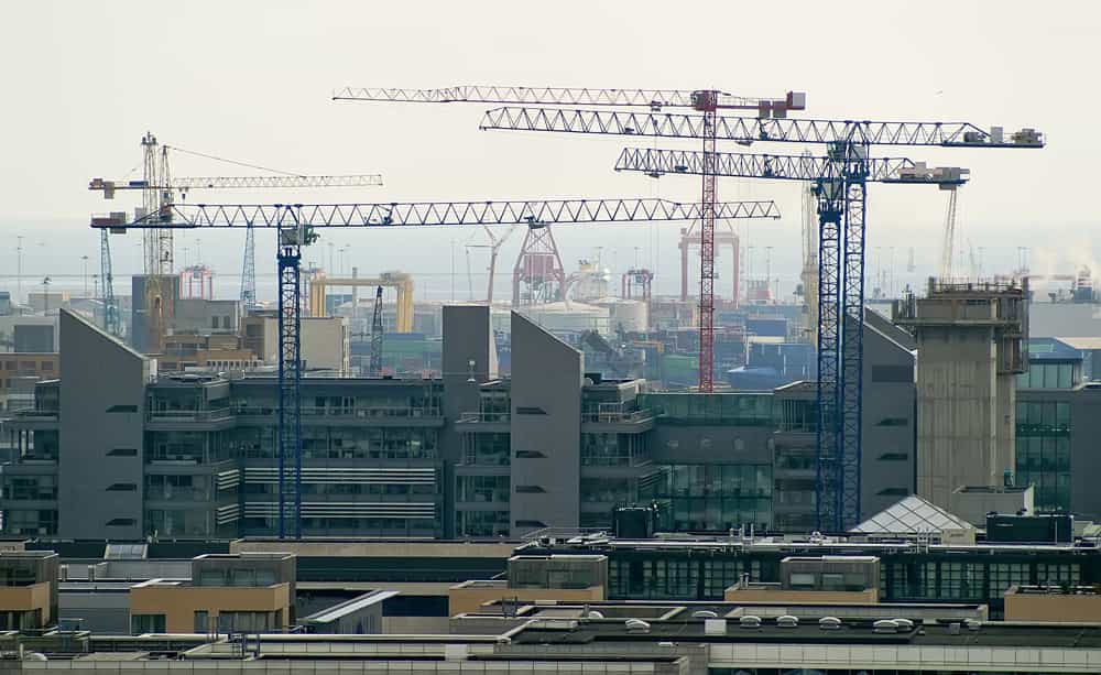 An aerial image of cranes above a downtown city centre